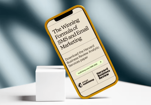 Mobile device showing the cover of the Harvard Business Review report with the title ‘Engage, Convert, Repeat: The Winning Formula of SMS and Email Marketing’