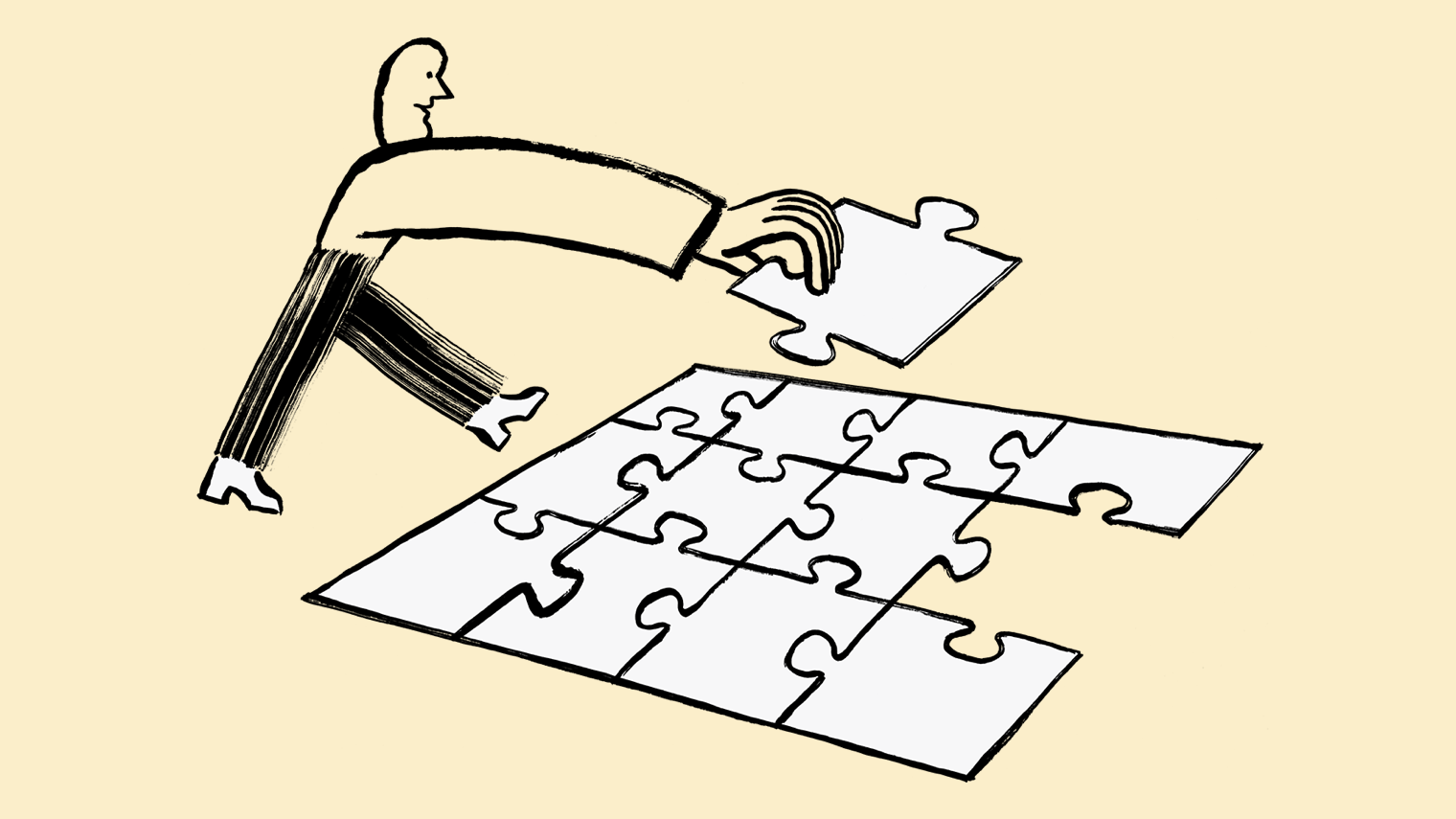 A person putting a puzzle together