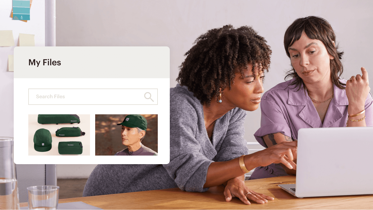 Two team members searching Mailchimp’s Content Studio for images to use in their marketing campaign.