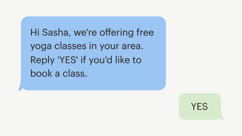 Blue and green chat bubbles. The blue bubble reads, "Hi Sasha, we're offering free yoga classes in your area. Reply 'YES' if you'd like to book a class." The green bubble reads, "YES."
